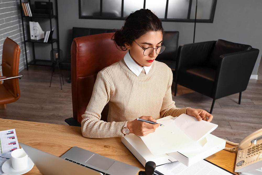 Female notary public working in office